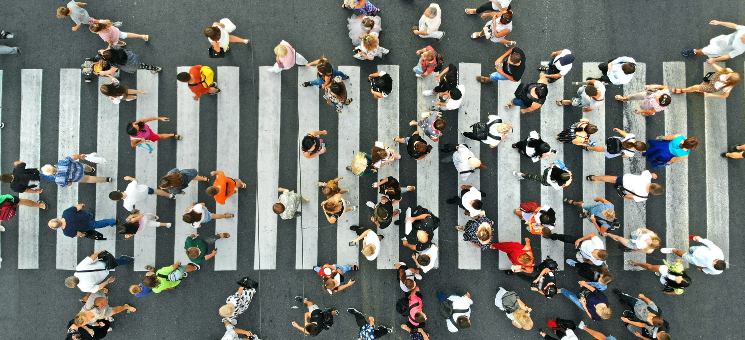 People walking across pedestrian crossing