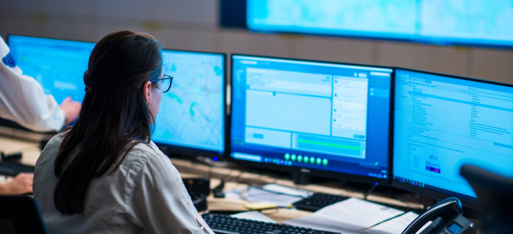 analyst checking the performance data on a computer