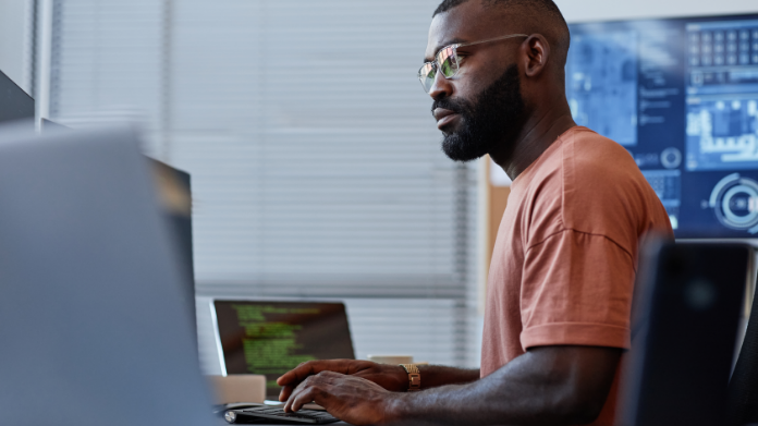 man analyzing data on a computer