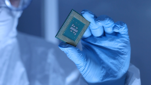 technician analyzing a microchip in a laboratory