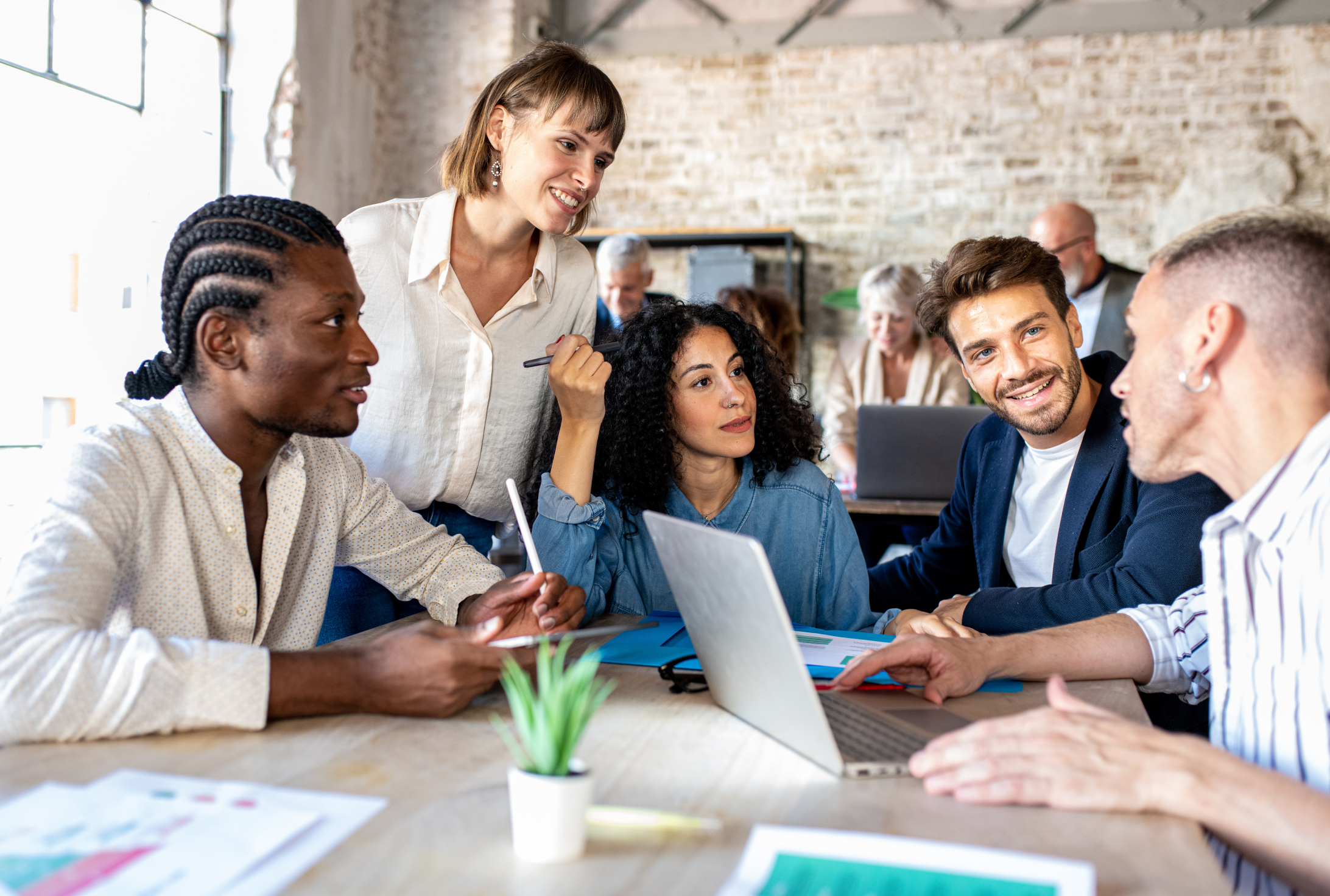 people of diverse race, gender and age working in an office