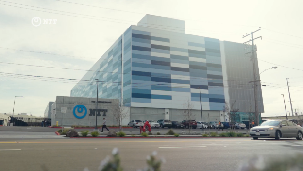 NTT building symbolizing sustainable data center innovation to support global AI growth and energy efficiency.