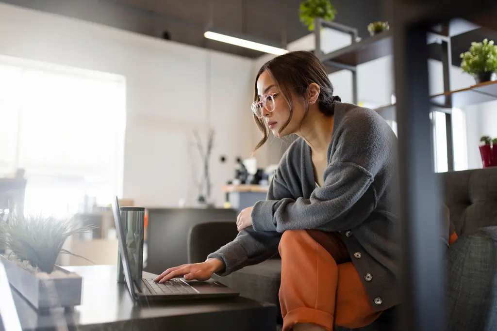 Young woman using technology at home