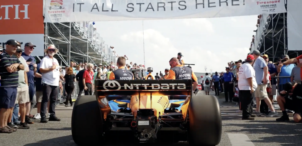 NTT DATA branded car at the start of an INDYCAR race