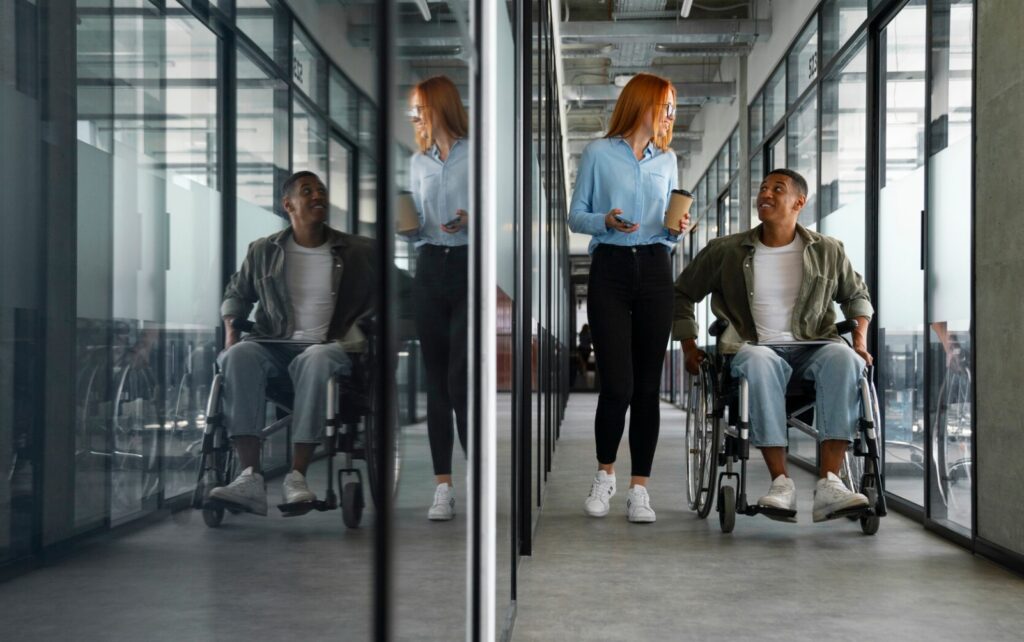 coworkers, one in a wheelchair, in the office