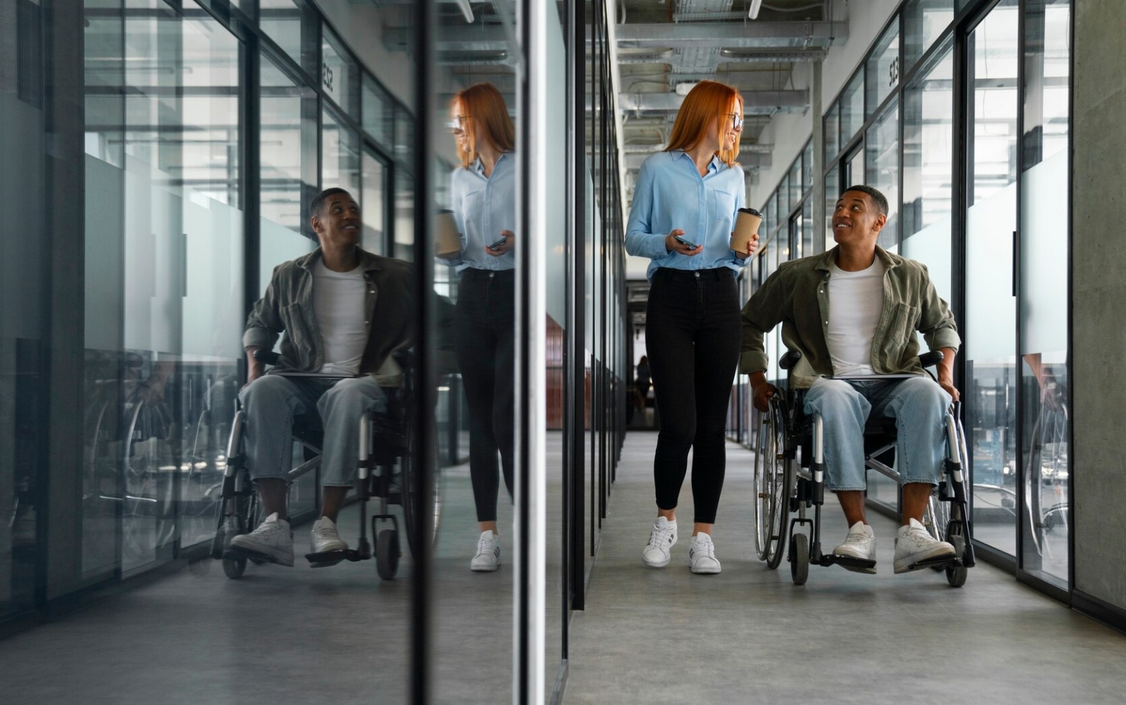 woman and man in a wheelchair talking through the hall of an office building