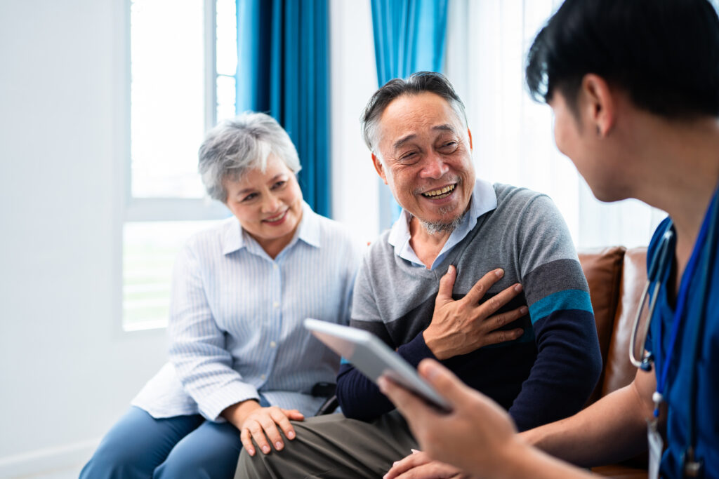 asian senior man consult and discuss his medical examination results with caregiver