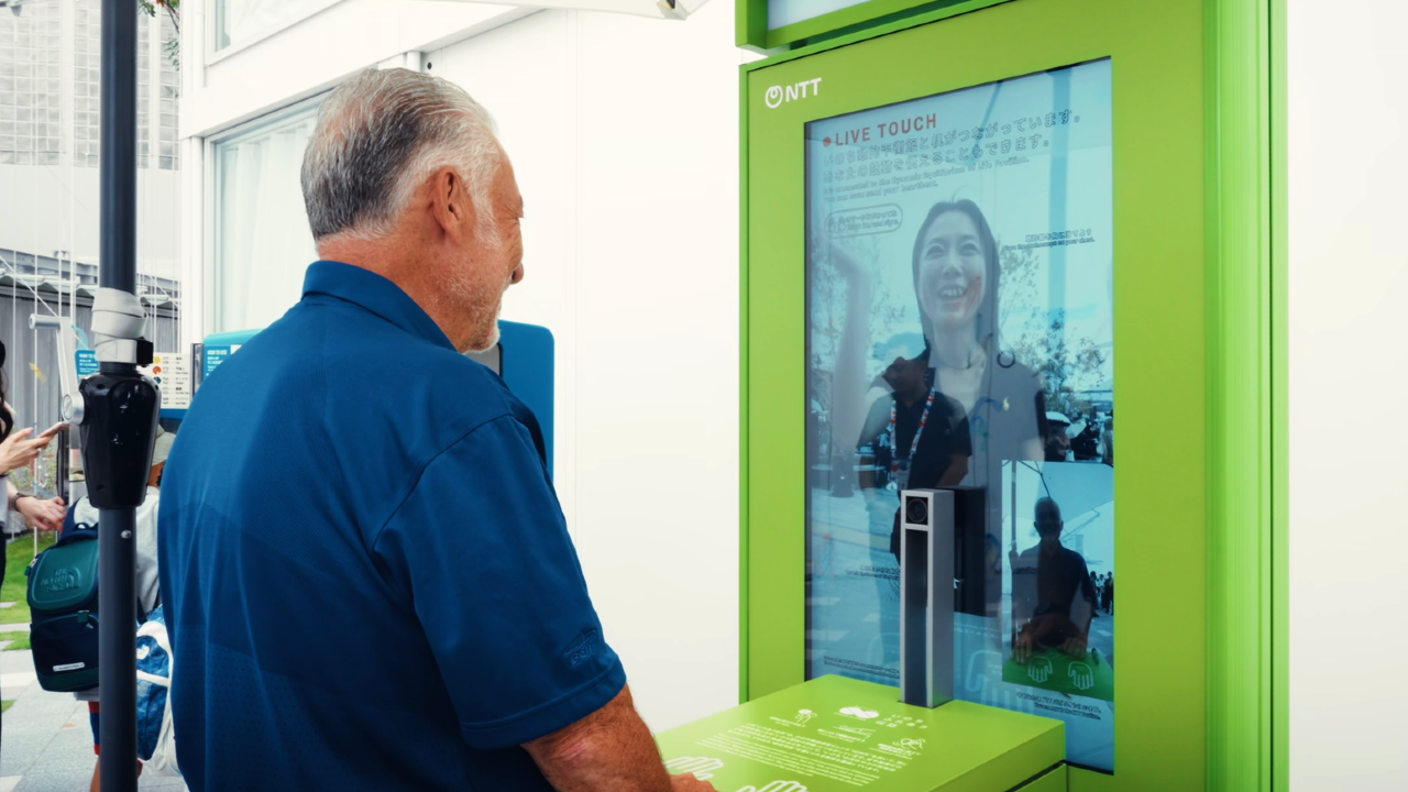 Vito Mabrucco, NTT Brand evangelist, testing the Life With Fure-au Denwa exhibit at Expo 2025