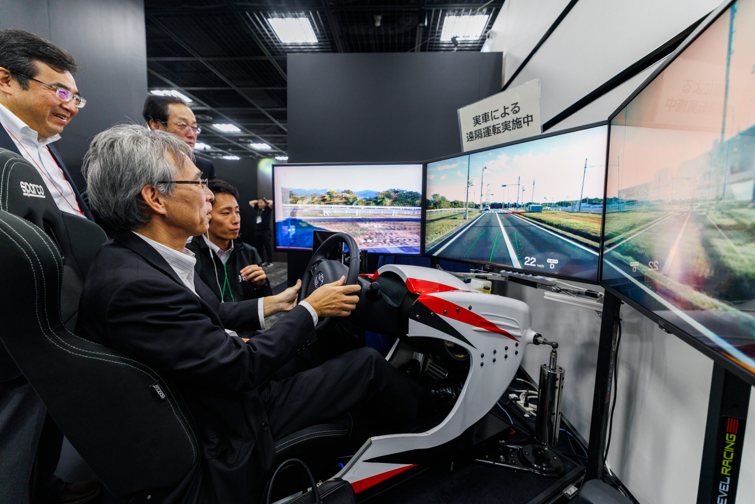 NTT R&D Forum attendees testing the remote mobility exhibit