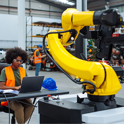 young black woman working with a robotic arm