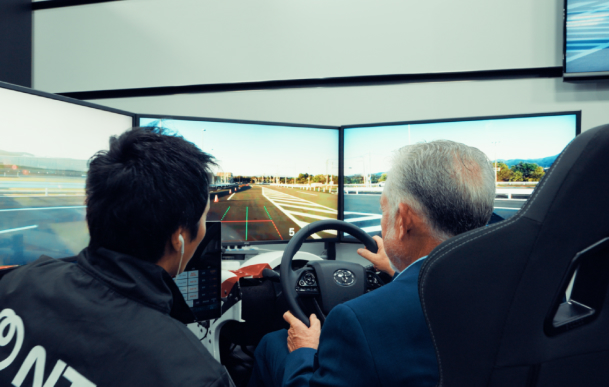 Two NTT employees testing the remote mobility exhibit